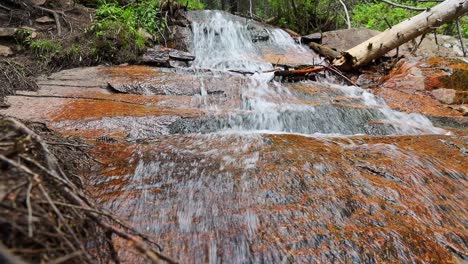 Waterfall-cascading-down-a-rockface-from-a-small-stream-filmed-in-the-Rocky-Mountains-of-Colorado-at-Staunton-State-Park