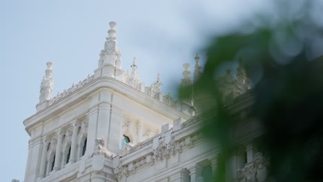 Slow-motion-close-up-shot-revealing-Ornate-gothic-Cibeles-Palace-in-Madrid,-Spain