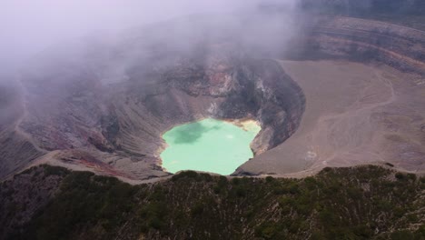Aerial:-Cloud-forms-over-hot-green-crater-lake-in-Santa-Ana-Volcano