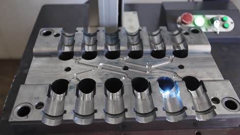 Die-of-injection-machine-in-which-laser-marking-is-taking-place