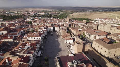 Aerial-orbiting-shot-over-Plaza-mayor-and-Bujaco-tower-in-Caceres,-Spain