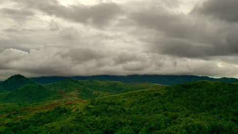 Cinematic-aerial-time-lapse-over-the-mountain-landscapes-of-Mabini,-Surigao-Del-Norte,-Philippines