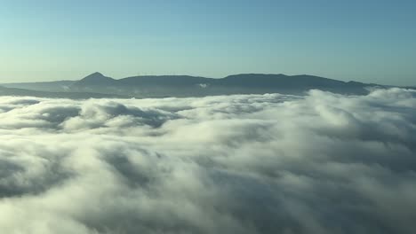 Overflying-a-foggy-valley-near-Pamplona,-Spain