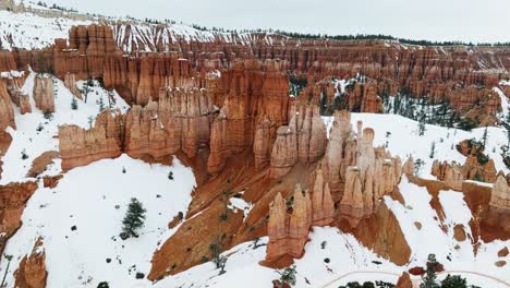 Bryce-National-Park,-Hoodoos-With-Snow-During-Winter-In-Utah,-USA---aerial-drone-shot