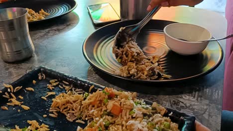 Serving-Fried-Rice-Indian-Recipe-on-plate-in-a-restaurant-closeup-look