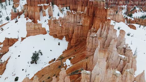 Orange-Rocks-Of-Bryce-Canyon-National-Park-In-Winter-In-Utah,-USA---aerial-drone-shot