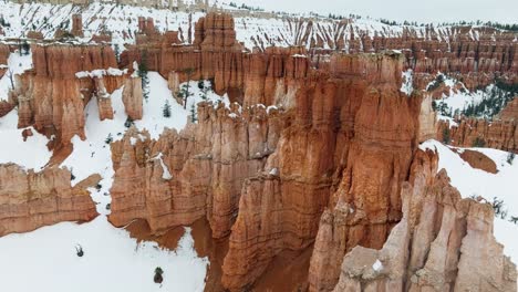 Bryce-National-Park-Red-Canyon-Covered-By-Snow-In-Utah,-USA---aerial-drone-shot