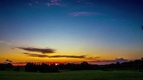 Timelapse-Sunrise-Over-the-Latvian-Landscape-with-Cirrus-Clouds-in-the-Skies