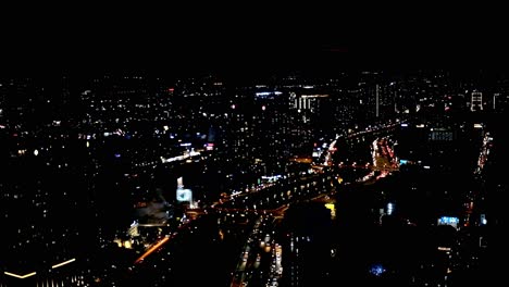 In-this-editorial-illustrative-view-from-the-Saigon-Skydeck-atop-the-Bitexco-Financial-Tower,-Ho-Chi-Minh-City-is-bejewelled-with-an-imposing-skyline,-beautiful-scenery-and-city-lights