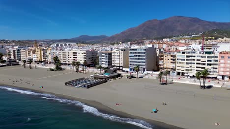 Aerial-view-of-spanish-beach-vacation-town-Estepona,-south-coast-of-Spain,-moving-right,-Mediterranean-sea,-Europe