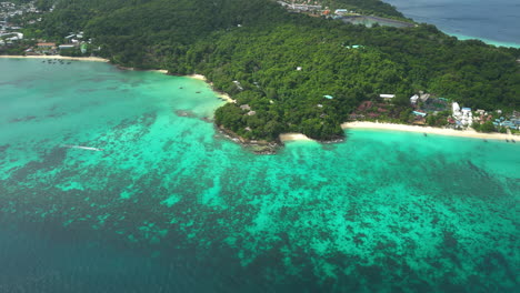 Aerial-pan-left-of-Long-Beach-Phi-Phi-on-sunny-day,-Thailand