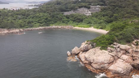 Aerial-Rising-Shot-From-Rocky-Coastline-To-Reveal-Island-View-Of-Cheung-Chau-In-Hong-Kong