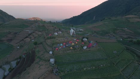Aerial-view-of-Skoter-Hill-in-Dieng-plateau-with-colorful-tents-build-at-the-top