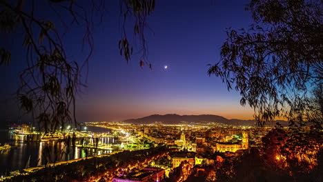 Crescent-moon-nighttime-time-lapse-of-the-Port-of-Malaga,-Spain