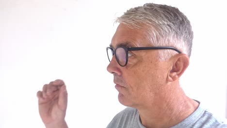 Middle-aged-white-male-removes-his-reading-glasses