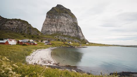 Norwegian-island-with-a-mountain-peak-and-a-fishing-village,-Sanna-island
