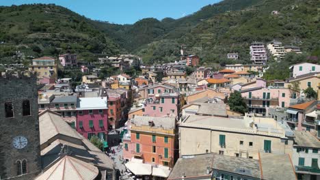 Backwards-Drone-Shot-Reveals-Monterosso-Italy-in-Cinque-Terre-on-Typical-Summer-Day
