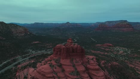 Bell-Rock-In-Sedona-Arizona's-Red-Rock-Landscape-At-Sunset---aerial-pullback