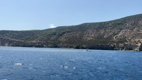 Mediterranean-sea-in-Paphos-filmed-from-boat,-up-close-establish-shot