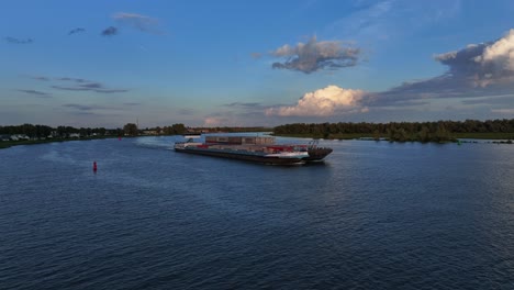 On-the-Oude-Maas-river-the-freight-barge,-the-Sento-sails-with-it’s-cargo