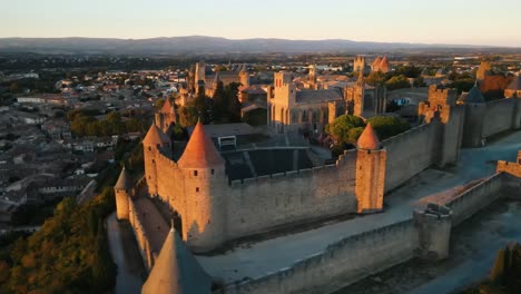 Aerial-establishing-shot-of-the-medieval-citadel-and-town-surrounding-Carcassonne,-France
