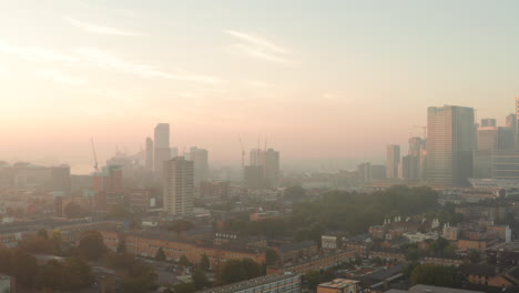 Aerial-shot-over-Poplar-London-in-the-mist-at-sunrise