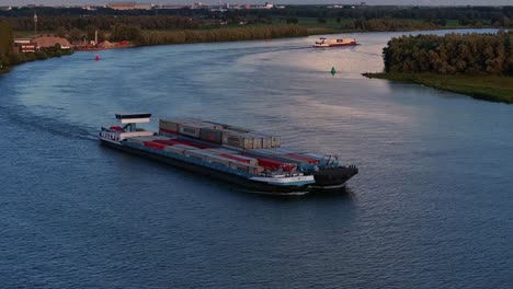 Cargo-vessel,-the-Sento-sailing-on-the-Oude-Maas-river-past-Barendrecht,-Netherlands
