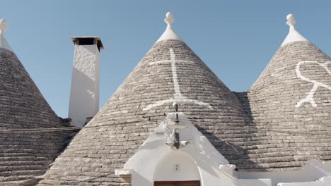 Stone-roof-with-signs-a-typical-trulli-from-alberobello-italy