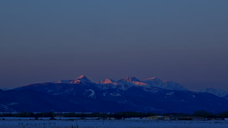 Timelapse-of-Snowy-Mountain,-Sunrise-Clear-Skies