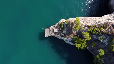 Trabucco-fisherhouse-on-a-cliff-sorounded-by-ocean-from-birds-eye