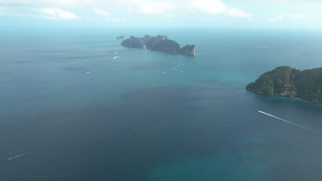 Scenic-aerial-panorama-of-turquoise-water-of-Andaman-Sea-and-Phi-Phi-Islands,-Thailand