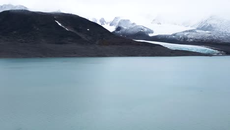 September-in-the-Arctic-Sea-in-front-of-a-glacier-with-mountains-in-the-background
