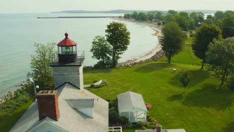 Drone-beauty-shot-of-the-historic-light-houses-museums-at-Sodus-point-New-York-vacation-spot-at-the-tip-of-land-on-the-banks-of-Lake-Ontario