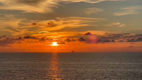 Oil-rig-in-the-Gulf-of-Mexico-at-sunset-with-orange-and-blue-sky