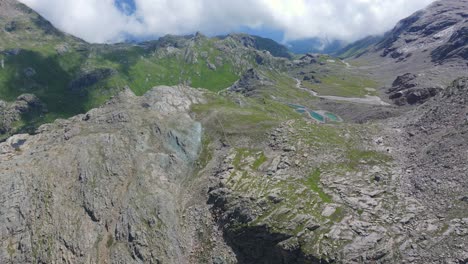 Flying-over-Valmalenco-mountains-in-Valtellina-region-in-summer-season,-Italy