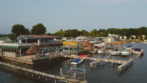 Drone-shot-off-the-restaurant-boats-and-docks-at-Sodus-point-New-York-vacation-spot-at-the-tip-of-land-on-the-banks-of-Lake-Ontario