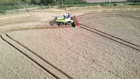Aerial-footage-of-a-combine-harvester-harvesting-a-wheat-crop
