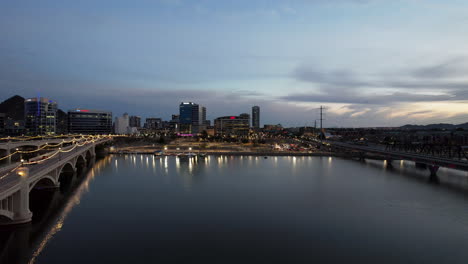 Tempe-Salt-River-Twilight-with-Aerial-Drone-Rising-Up-with-City-Skyline-View-in-Arizona,-USA
