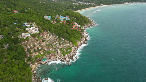 South-of-Koh-Tao-Island-coastline,-Hillside-luxury-resort-at-seashore,-Thailand,-Aerial-View
