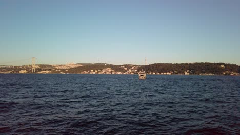 Evening,-cinematic-slow-mo,-an-enchanting-view-of-Istanbul's-Asian-continent-from-a-ferry-on-Bosphorus