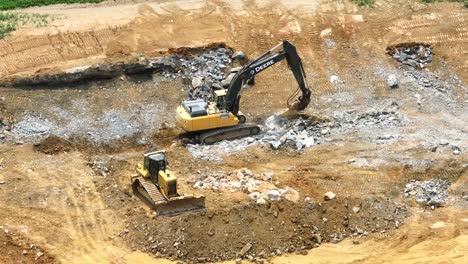 Deere-excavator-with-rock-blaster-attachment