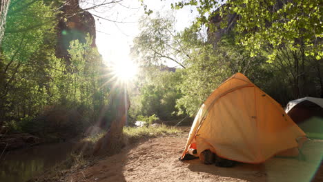 Campsite-by-the-river-in-the-early-morning-sunlight
