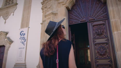 girl-looking-at-church-of-mercy-in-viseu-portugal-entrance-slow-motion