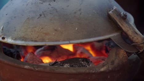 Process-making-traditional-food-"Kerak-Telor",-The-cooking-process-on-a-charcoal-stove