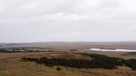 Panning-drone-shot-of-a-peatland-wind-farm-near-Stornoway-on-the-Hebrides
