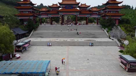 Drone-revealing-Huaxiacheng-large-scale-cultural-scenic-area-in-Weihai-city-with-oriental-zen-traditional-temple