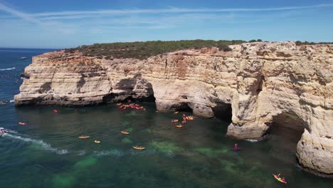 Flying-over-Praia-Da-Marinha--in-Algarve,-Portugal