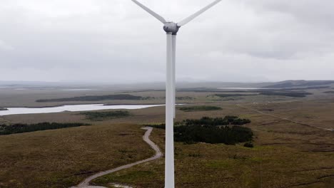 Drone-shot-of-a-Scottish-wind-turbine's-tower,-blades,-motor-and-nacelle