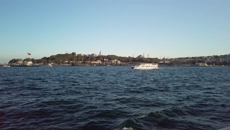 Evening,-cinematic-slow-mo,-a-mesmerizing-view-of-Sarayburnu-from-a-ferry-on-the-Golden-Horn-in-Istanbul