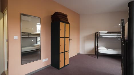 Youth-Hostel-Dorm-Room-with-Wardrobe,-Blankets,-and-Bunk-Bed